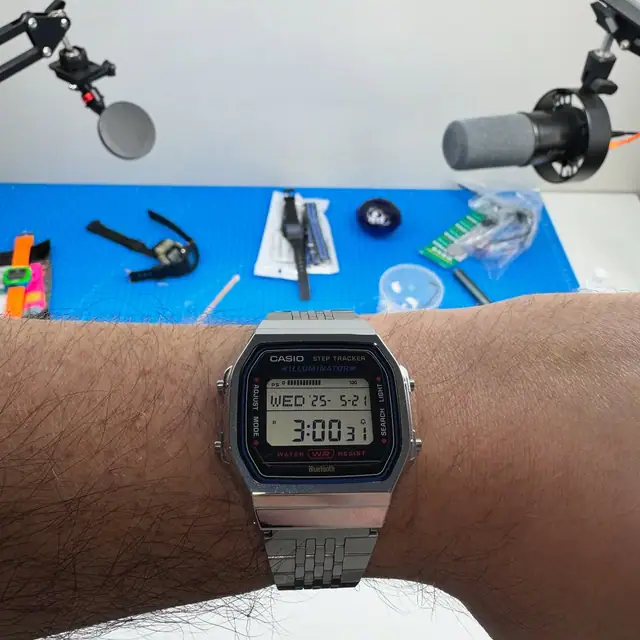 Casio ABL-100 step-tracking watch worn on a wrist outdoors