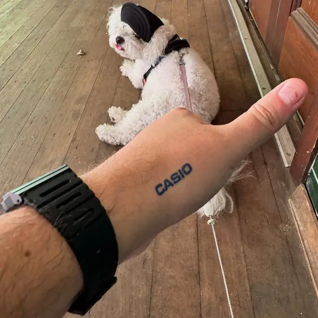 Underside strap view of the Casio CA-53W with Casio wrist tattoo and Bubble the dog