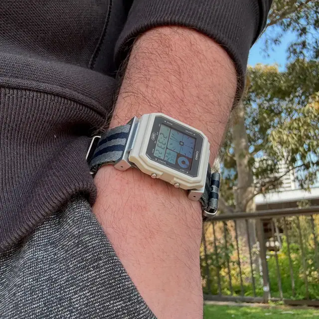 Modified Casio LF-20W on a wrist with a blue strap and custom case