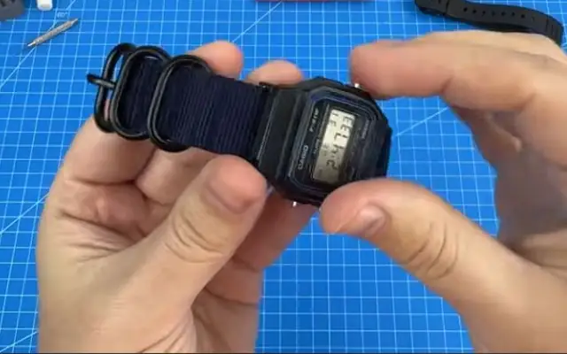 My F-91W with the navy Zulu strap and adapters, from my build video at 03:11.